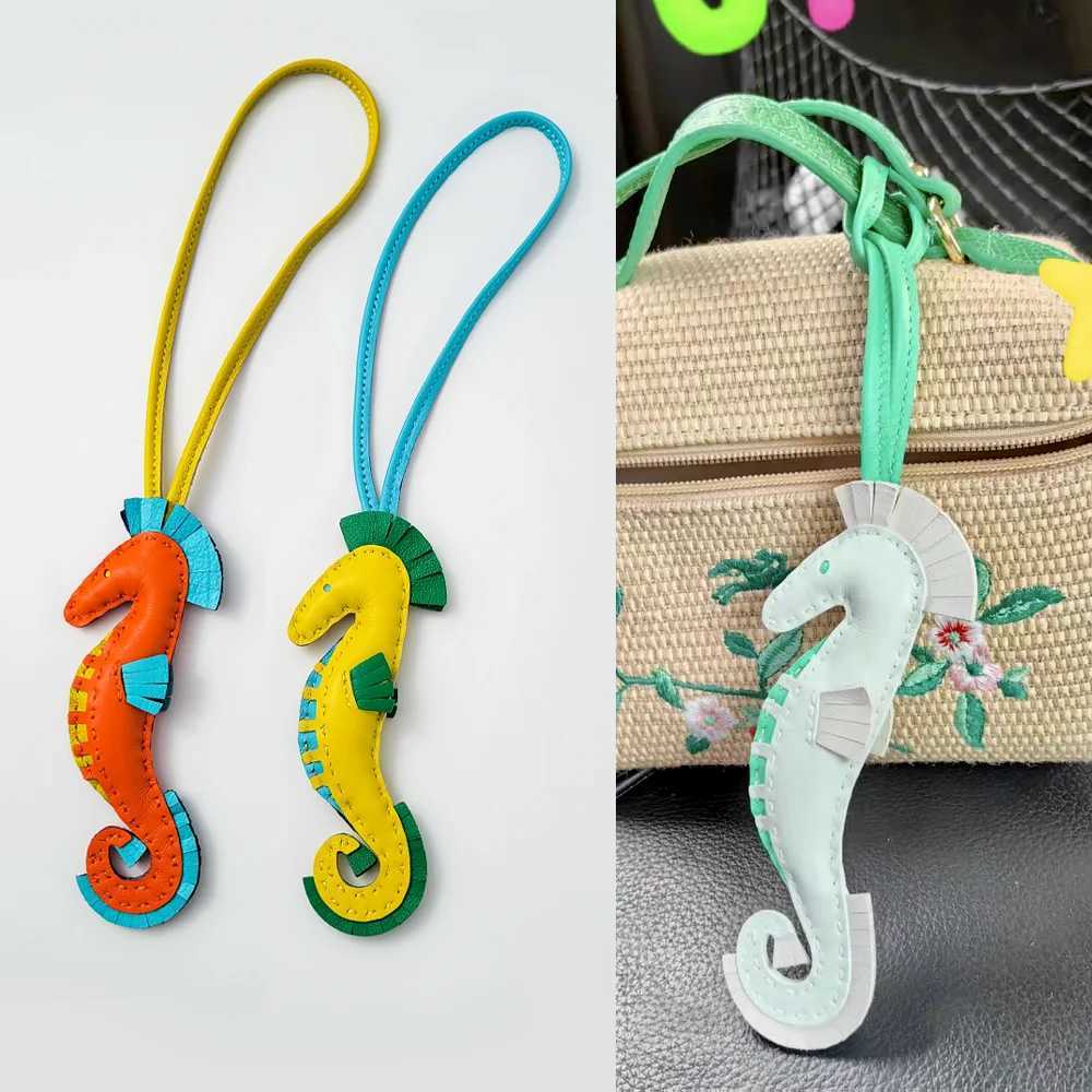 Cuir de vache belle breloque de sac hippopotame décoration de goutte de cheval de mer ornement suspendu à la main porte-clés sac accessoires xj25