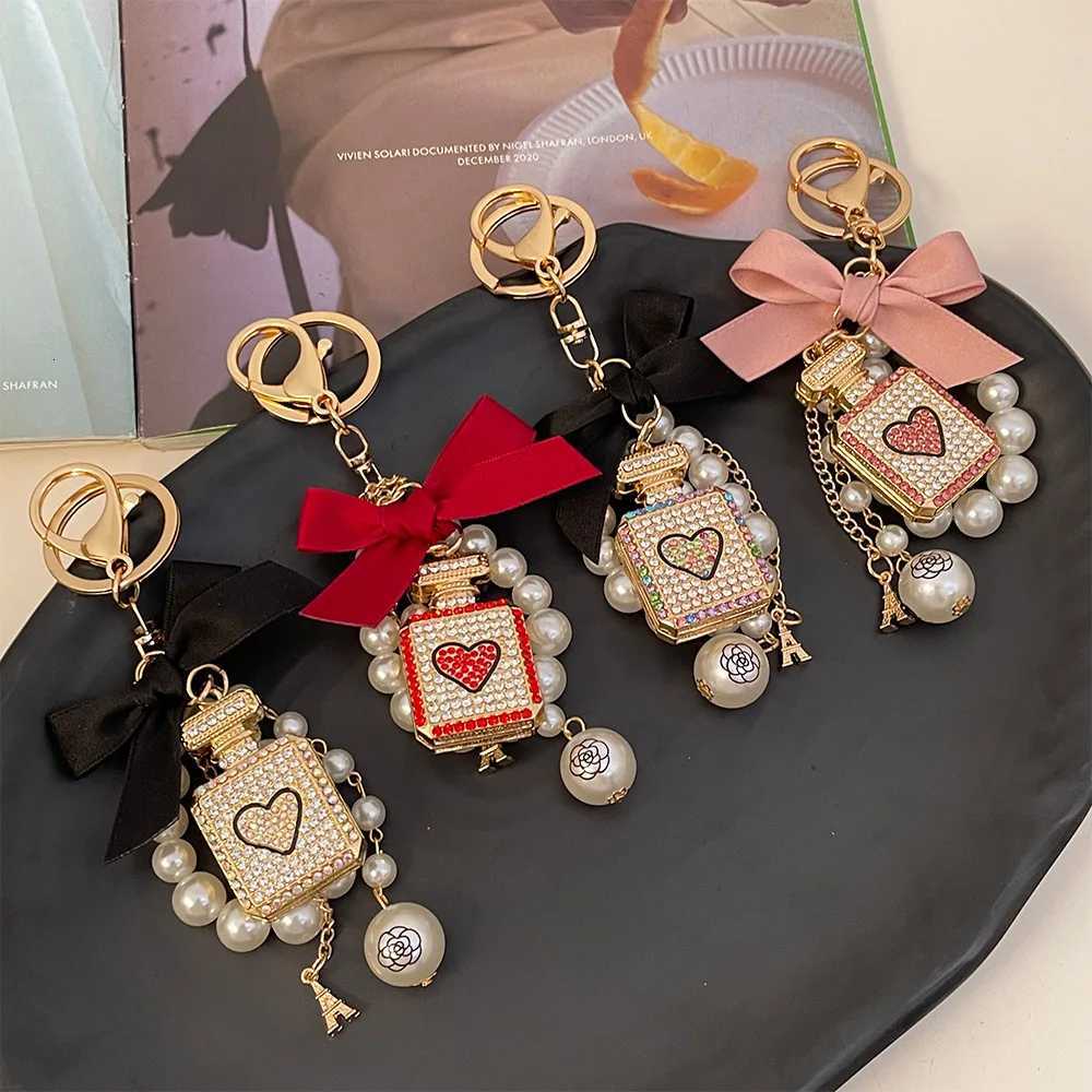 luxury keychains big brand New Handmade Bowknot Pearl Key Chain with rhinestone perfume Bottle Car keychain Womens Bag PendantXJ251114