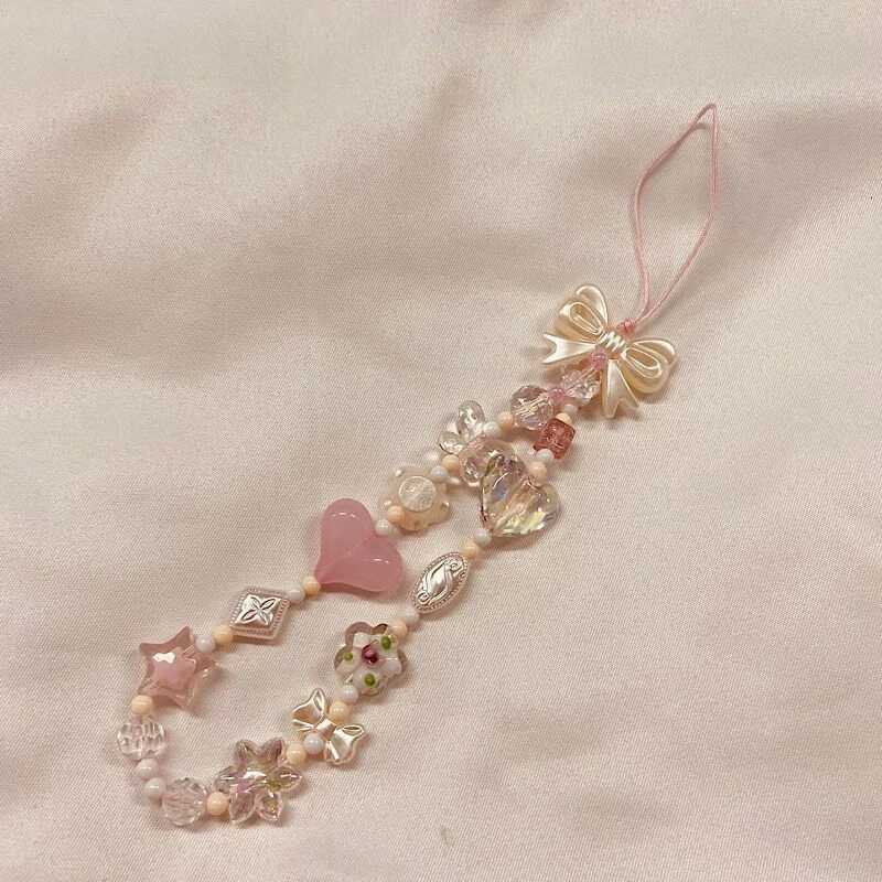 Version coréenne de la belle fleur de cerisier rose amour arc perles téléphone chaîne sac lanière porte-clés charme sac à dos charme cadeau XJ251