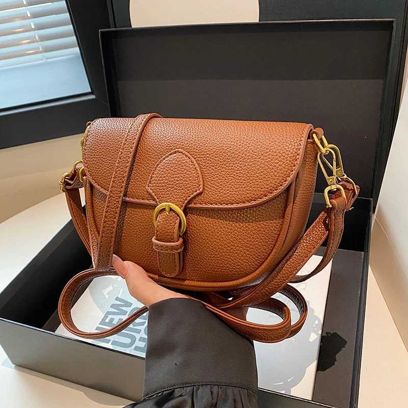 Brand designer small saddle cross shaped bag suitable for womens shoulder bags handbags black brown khaki semi-circular handbags retro womens bag