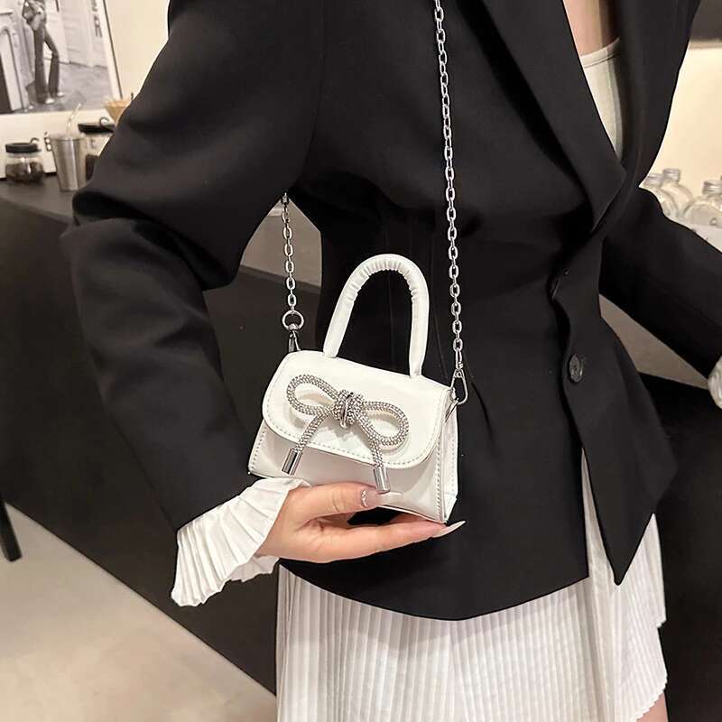 Borse a tracolla con patta in pelle PU a tracolla in tinta unita con design a fiocco per zaino per borse da donna e borsette a catena da donna all'a
