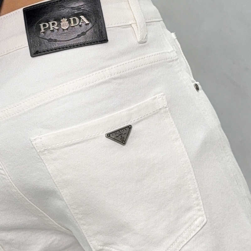 Guangzhou Xintang jeans mens cotton elastic Korean version straight tube loose high-end European black and white youth long pants L26624