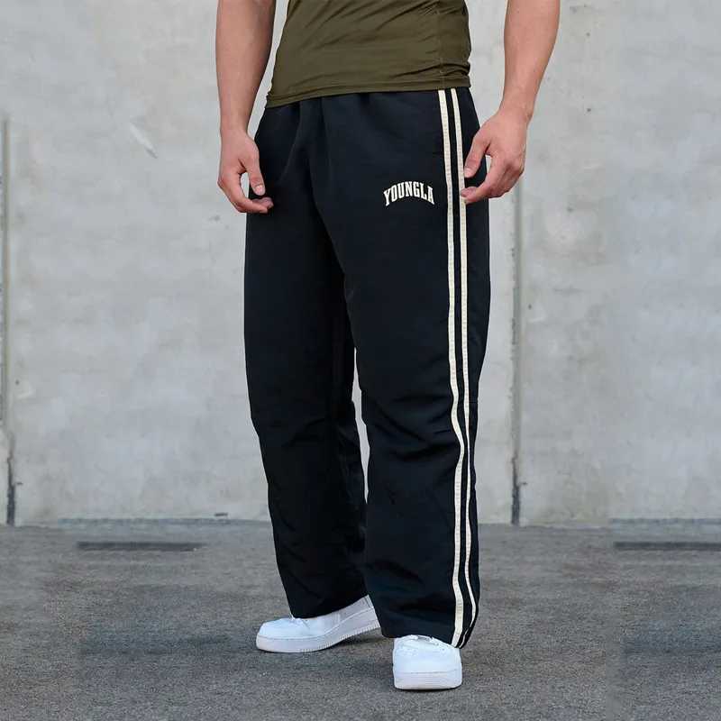Pantalon pour hommes jogger pour hommes pantalons de survêtement gymnase sportive fitness bandes d'épissage imprimant mi-taille pantalon décontra