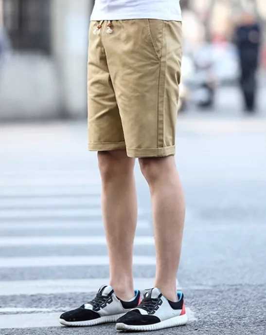 2025 new mens summer elastic five point shorts made of pure cotton and tied with a rope solid color shorts for teenagers W250610
