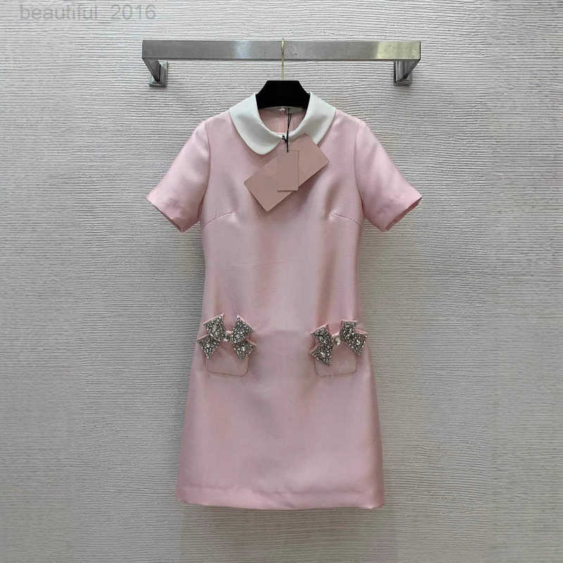 Robes décontractées de base Designer 2025 Élégant et réduction de l'âge Coll-Down Cold-Down Breed Bow Robe à manches courtes 9JS8