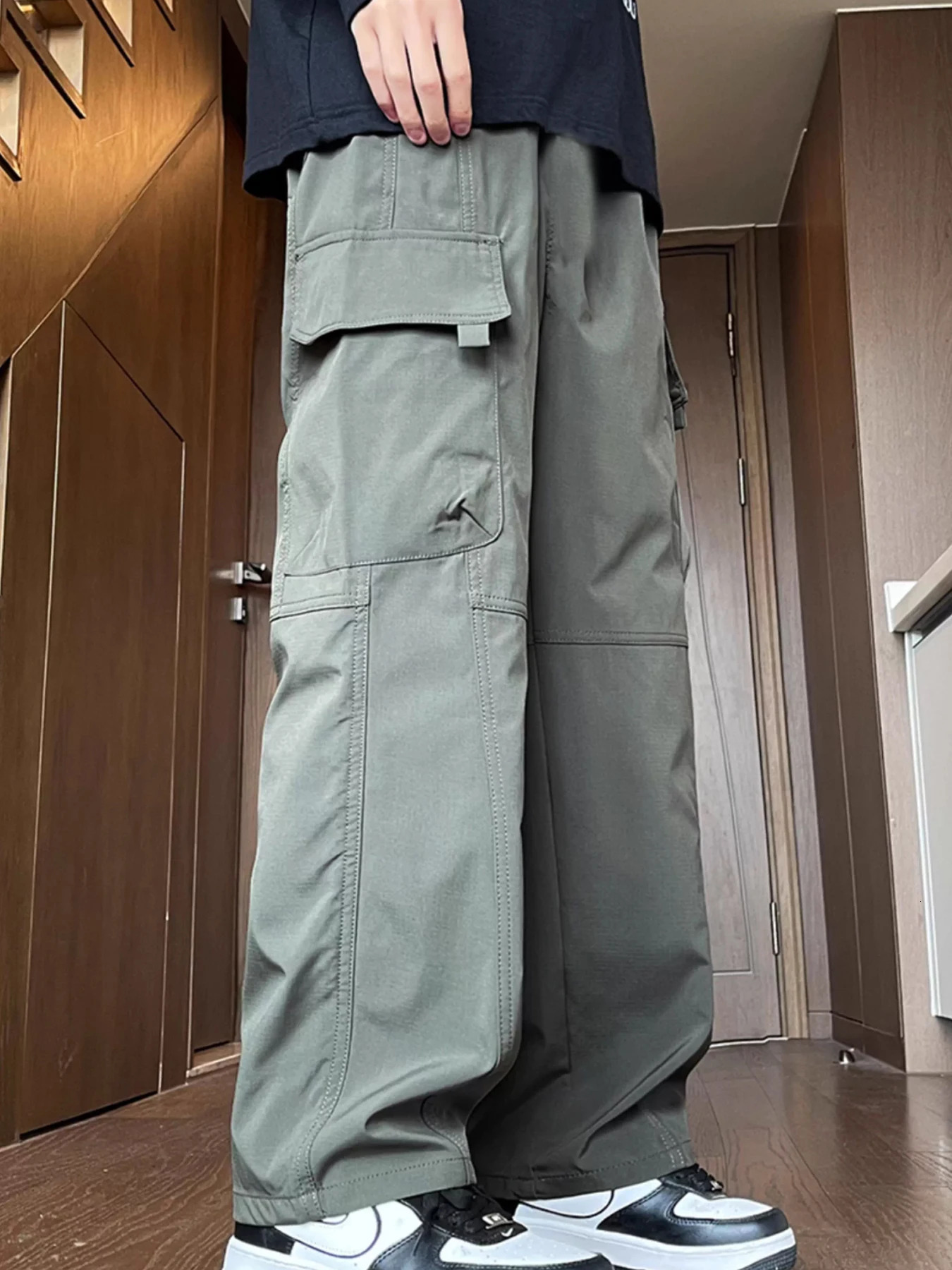 Streetwear Mens Cargo Pants Multi Woven Pocket Foot Rope Hip-Hop Baggy Trousers Solid Drawstring Parachute Pants Men Clothing 250616