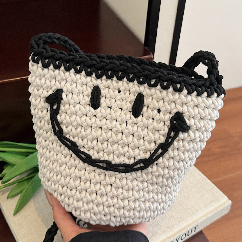 Free shipping designer Women Bag 2025 Japanese Style New Bag Bucket Bag Knitted Bag Smiley Face Small Bag Summer Woven Bag Vacation Beach Bag