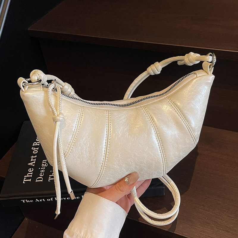 Free shipping designer Bag 2025 New Niche Design Trendy Simple Solid Color Horn Bag Versatile Commuter Fashion Shoulder Bag Crossbody Bag Women Bag