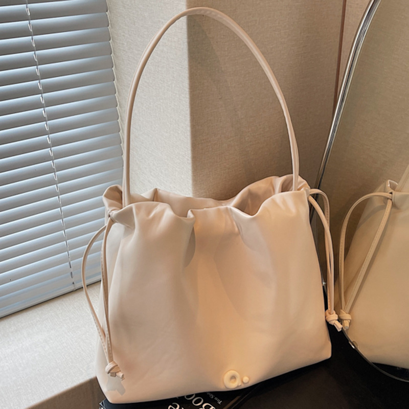 Free shipping designer Bag Summer New French Style Casual Oil Wax Leather Underarm Tote Bag Women Bag Textured Commuter Simple Shoulder Bag