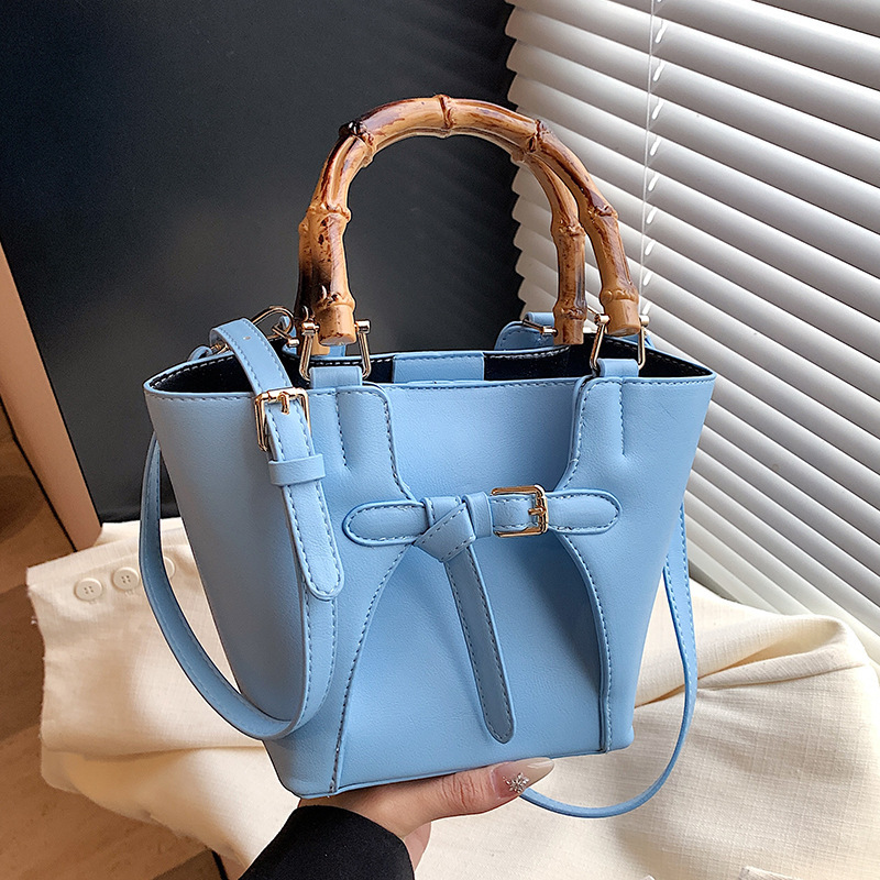 Free shipping designer Bag Niche Casual Texture Bamboo Handle Bag Bucket Bag Versatile Commuter Elegant Crossbody Bag Mother Bag Women Bag