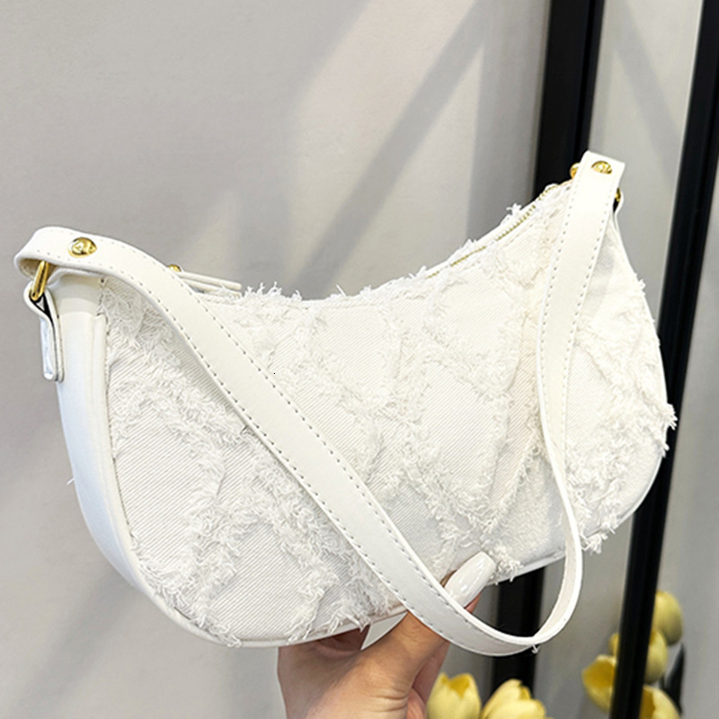 Free shipping designer Bag Underarm Bag 2025 Summer New Fashion Trendy Women Bag Denim Fabric Stylish Quilted Frayed Shoulder Bag