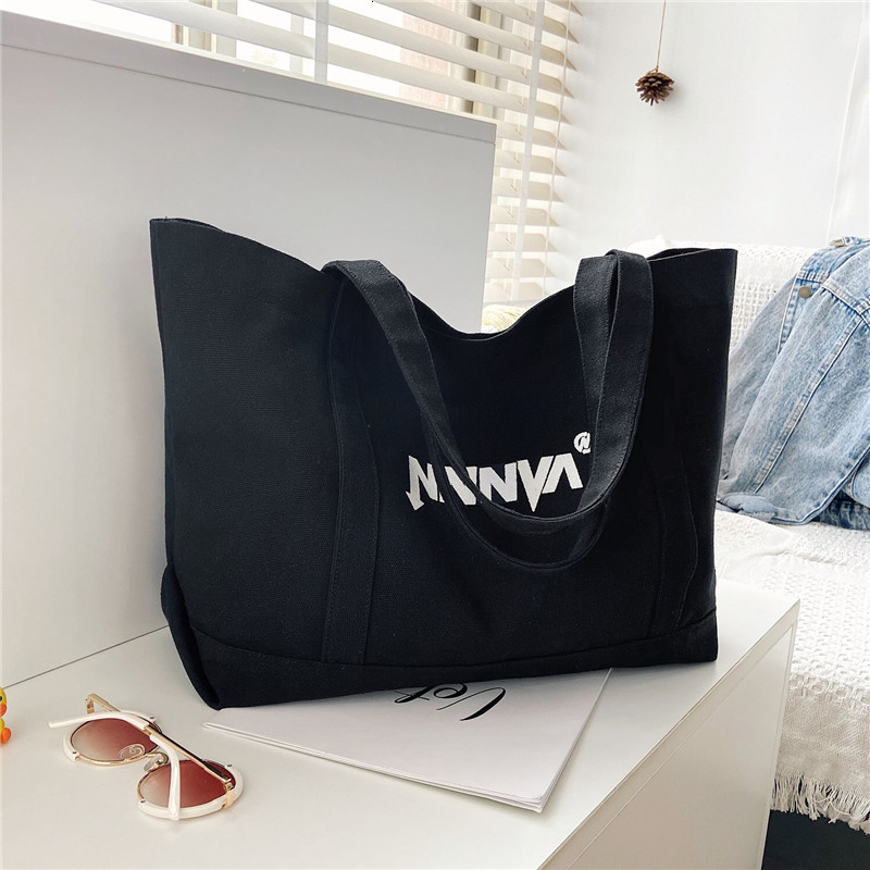 Canvas bag womens one shoulder large capacity fashionable versatile black fashion handbag for students in class 250617