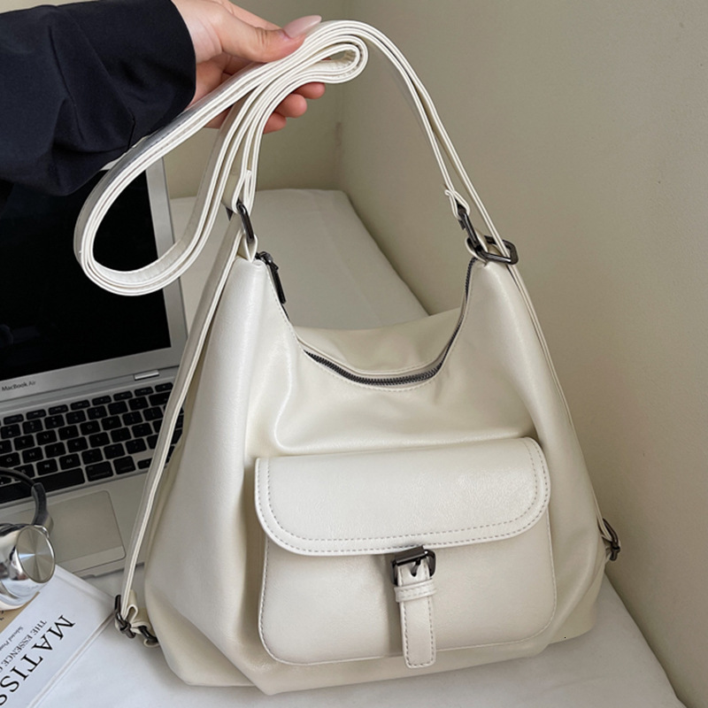 Free shipping designer Bag 2025 New Korean Style Simple Large Capacity Tote Bag Women Fashion Personality Belt Buckle Motorcycle Style Backpack Shou