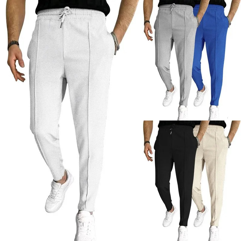 Spring and Fall mens Waffle Leisure sports solid color pants trend fashion high quality drawstring small leg pants 250619