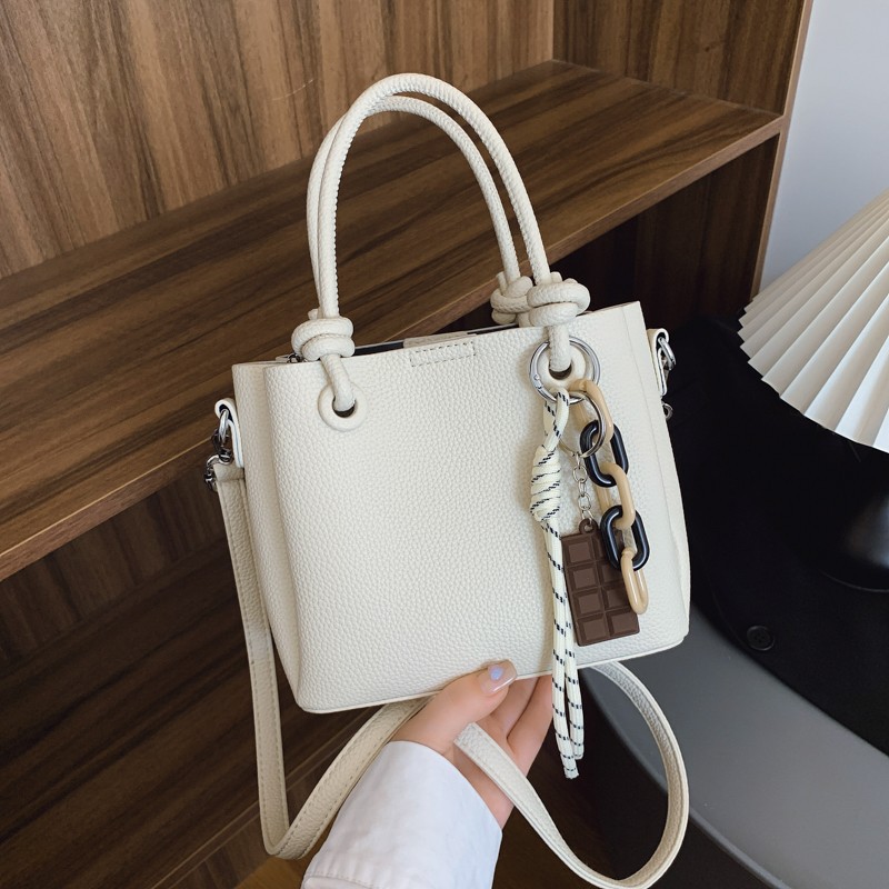 2025 Women's Fashionable Niche Commuting Handheld Small Square Simple Textured Bucket Solid color Shoulder and Cross - body Bag