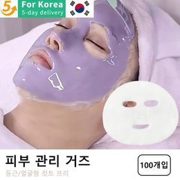 Dispositifs de soins du visage 100pcs blanc jetable masque de gaze spa feuille de papier salon de beauté bloc spécial pré-coupé fibre de peau 231024