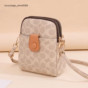 Liquidación de fábrica Nuevo bolso de diseño popular Nuevo bolso de moda y de hombro Mini Shell