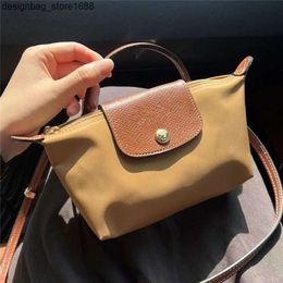 Fábrica Alta calidad Al por mayor de calidad Longxiang Mini Bag Dumpling Bag Womens Handheld Handbag Many Ballet Crossbody de billetera móvil