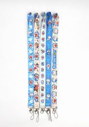 Prix usine 100 Piec Doraemon Anime Longe Porte-clés Courroie De Cou Clé Caméra ID Téléphone Chaîne Pendentif Badge Partie Cadeau Accessoires En Gros
