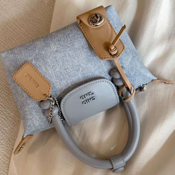 Bolso de hombro de fábrica Tienda Envío gratis Platinum Blue Danning Tote para mujer 2024 Nuevo bolso pequeño y cruzadoOWX9