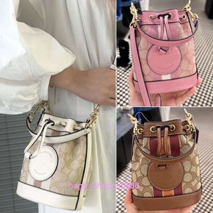 Venta al por mayor de fábrica 2024 nuevo Olay bolso para mujer Mini Dempsey cordón cubo Sakura rosa un hombro bolso cruzado