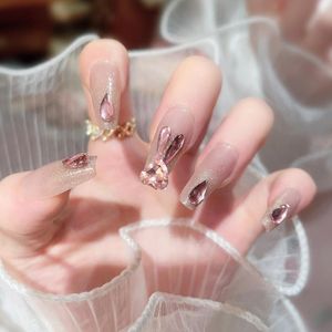 Faux ongles 24 pièces/boîte strass roses faux avec des conceptions Kits d'ongles en acrylique Long cercueil Ballet presse sur les conseils de mode