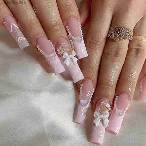 Valse nagels 24 -stks roze valse nagels Lang ballet eenvoudige vlinderdas met strijkbeen draagbare nep nagels Franse volledige deksels op nagels tips kunst y240419tzx5