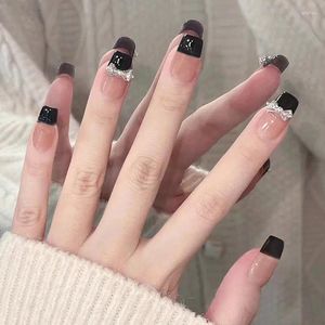 Faux ongles 24 pièces portant des autocollants et des arcs à ongles noirs de luxe haut de gamme avec des outils de diamants sont inclus