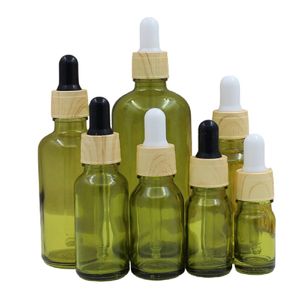 Couvercle en plastique en faux bois Bouteille en verre vert olive Emballage cosmétique Conteneurs rechargeables Flacons compte-gouttes en caoutchouc d'huile essentielle vide 5 ml 10 ml 15 ml 20 ml 30 ml 50 ml 100 ml