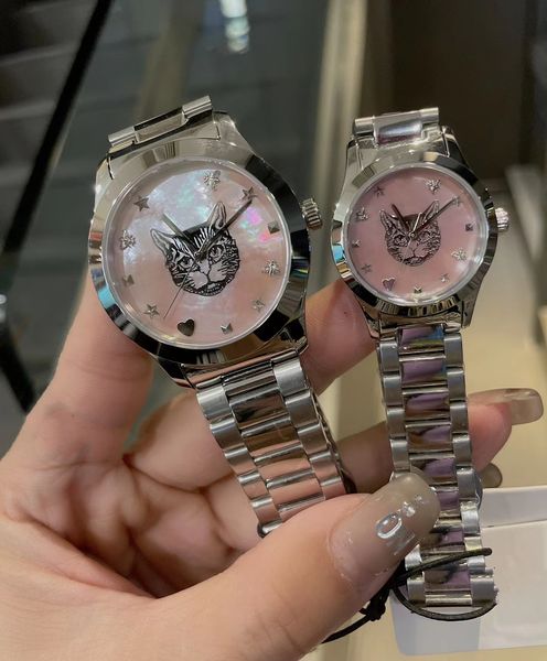 Célèbre marque femmes hommes couple montre à quartz intemporel imbriqué G nacre coquille cadran motif CAT horloge en acier inoxydable étoile coeur abeille charmes montre-bracelet