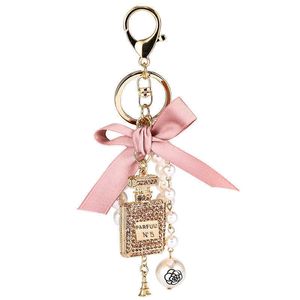 Beroemde BrandCherryFashion Imitatie Pearl parfumfles Keychain -auto Key Ring Women Bag Charm Accessoires Cute Bow Key Chain Creative Keyrings G1019