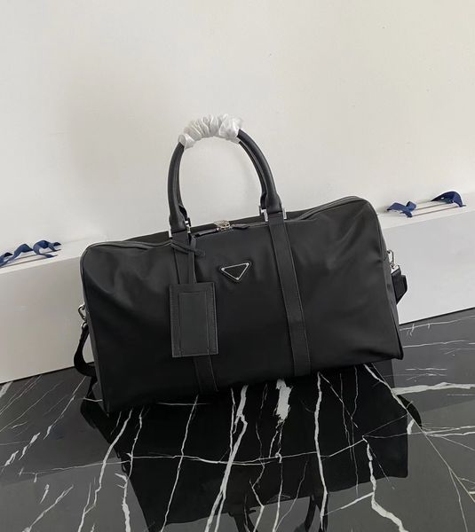 Sac à bagages de créateurs célèbres, sac de voyage, classique noir et à la mode nouveau sac à grande capacité, imperméable universel et résistant à l'usure pour les hommes et les femmes