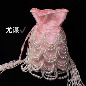 Célèbre socialite gland perle soie satin cordon seau industrie lourde tissé à la main perles perlées portant sac à bandoulière