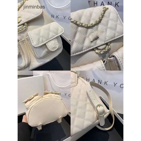 Mochila de moda Fábrica % 85% Venta al por mayor y al por menor Xiaoxiang Mochila Duma Pequeñas mujeres Lingge Ovejas Cordón Cadena Mini Bolsa para libros