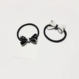 Mode zwart en wit acryl vlinder knoop haarring rubberen banden haarring hoofd touw haarspeld voor dames favoriete hoofdtooi sieraden accessoires vip cadeau