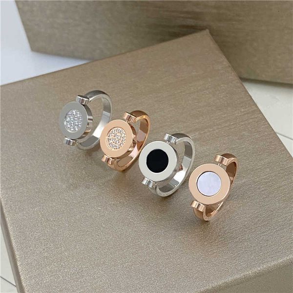 Moda Bvlgr joyería marca diseñador accesorios para mujer anillo con conchas de doble cara en blanco y negro anillo de pareja de diamantes tachonado de estrella de acero de titanio giratorio