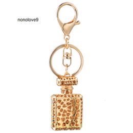 Design de mode porte-clés bouteille de parfum porte-clés pour femmes créatif cristal strass diamant métal voiture porte-clés chaîne sac pendentif cadeau porte-clés