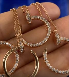 Modeontwerper gebogen nagel hanger ketting koperen frame verguld door 18k rozegold/goud/sterling zilver met cadeaubonverpakking