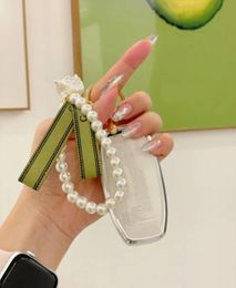 Diseñador de moda mujer llaveros cadena de teléfono móvil Vintage Lily of the Valley compacto lindo perla aleación amor mariposa