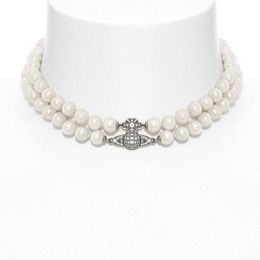 Créateur de mode Reine Mère Saturne Perle Diamant Collier de femmes Double couche planète Collier de perles Étoiles japonaises et coréennes Bijoux cadeau