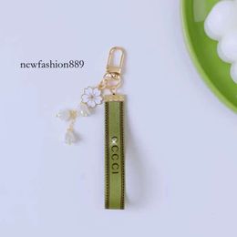Créateur de mode à la mode porte-clés clés pendentif boucle classique lettre tissu perles chaîne 4 styles de haute qualité porte-clés ornements