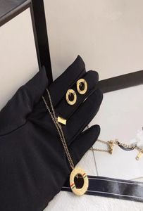 Mode double lettre cercle boucles d'oreilles collier de haute qualité charmant bijoux en acier inoxydable créateur fleur pendentif classique marque 4821249