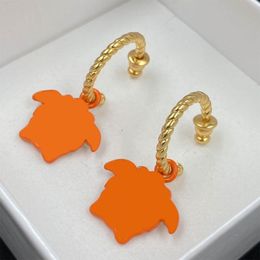 Boucles d'oreilles de mode Orange Low-Key Luxury Charm Designer Oreurs simples pour l'homme Femmes