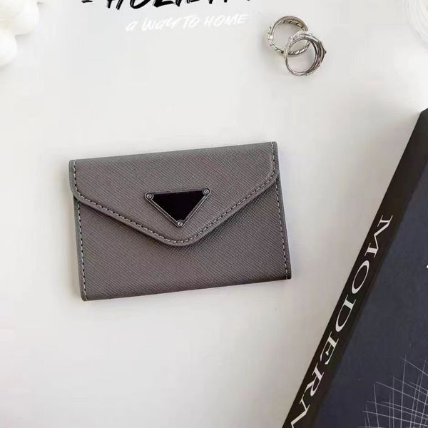 Moda Flip Cover Titular de la tarjeta Cartera Mujer Diseñador de cuero genuino Mini Monedero Hombre Documento de viaje Tarjetas de crédito Bolsa de bolsillo Regalo al por mayor