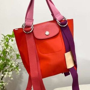 Fashion Handbag 80% Promotion d'usine FALONGXIANG Sac en toile en nylon en cuir authentique Nouveau sac à épaule de blocage de couleur TORMO