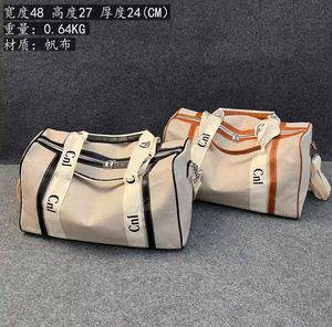 Mode haute qualité sacs de voyage sacs à main en toile grande capacité fourre-tout bagages à main sacs polochons luxe unisexe bagages lettre sac à main
