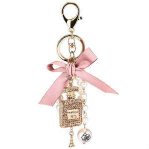 Mode Imitatie Parel Parfumflesje Sleutelhanger Auto Ring Vrouwen Tas Charm Accessoires Leuke Boog Sleutelhanger Creatieve Sleutelhangers G1019