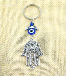 Joyería de moda Azul Evil Ojo Lucky Fatima Hamsa Hand Turkish Evil Eye Charm Protection Crystals Car Feng Shui Keychain12530649