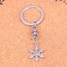 Mode sleutelhanger 23*17 mm sneeuw sneeuwvlok hangers diy sieraden auto sleutelhanger ringhouder souvenir voor cadeau