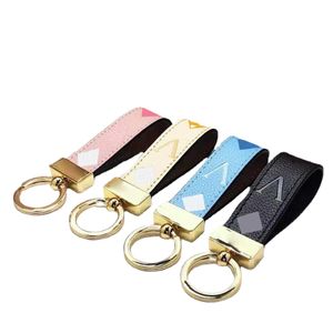 Mode porte-clés classique exquis luxe concepteur voiture porte-clés porte-clés en alliage de Zinc lettre unisexe lanière or noir métal